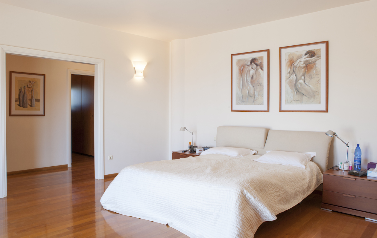 The bedrooms have beautiful wooden flooring property for sale in Rhodes, Greece