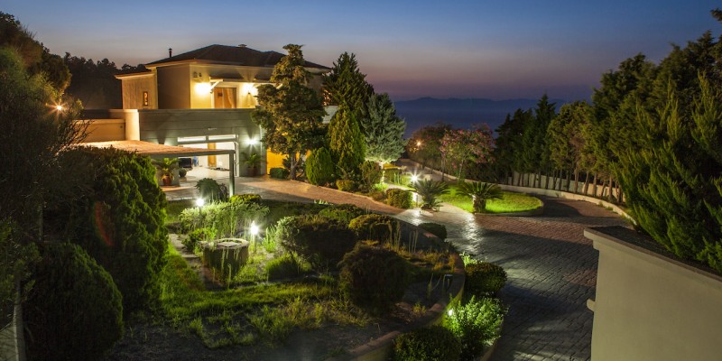 Garden lights emphasising the landscaped terrain property for sale in Rhodes Greece