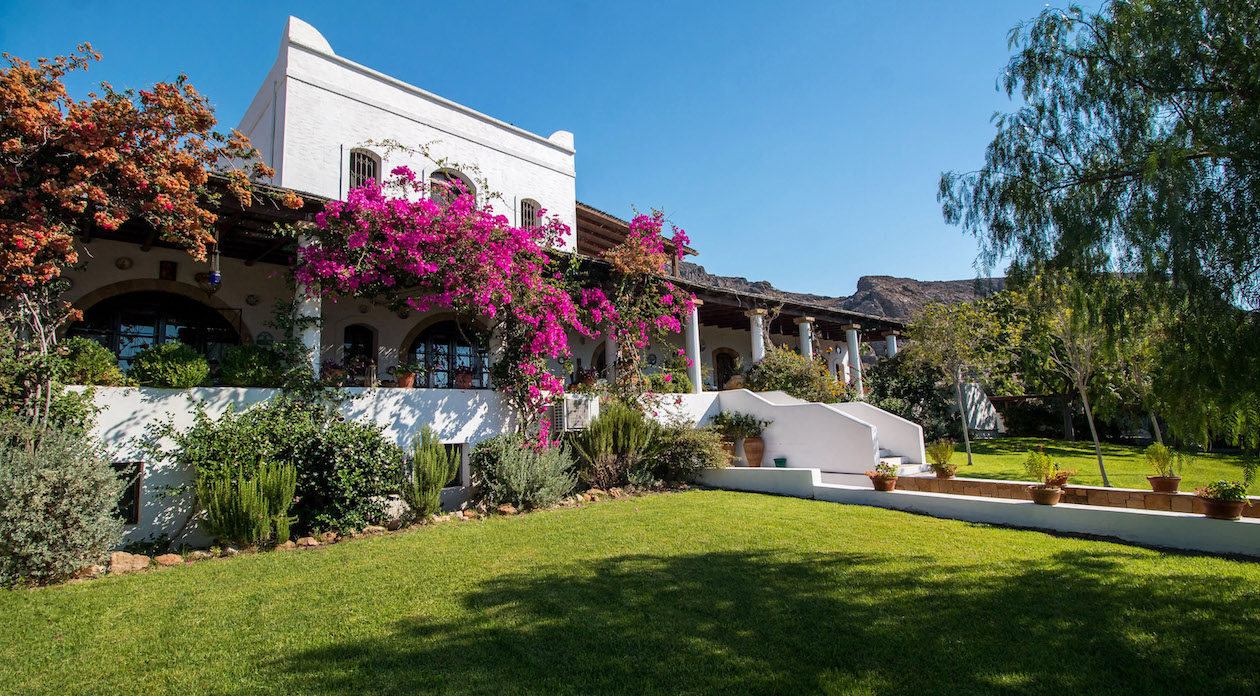 Bougainevillia covered Terrace and lush gardens property for sale in Rhodes, Greece