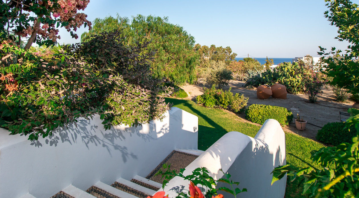 White washed steps to the stunning gardens property for sale in Rhodes, Greece