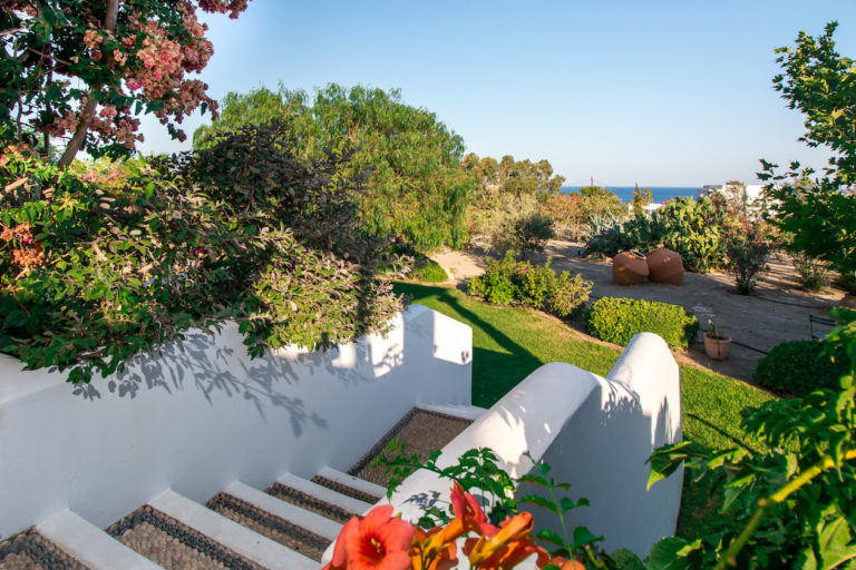 White washed steps to the stunning gardens property for sale in Rhodes, Greece