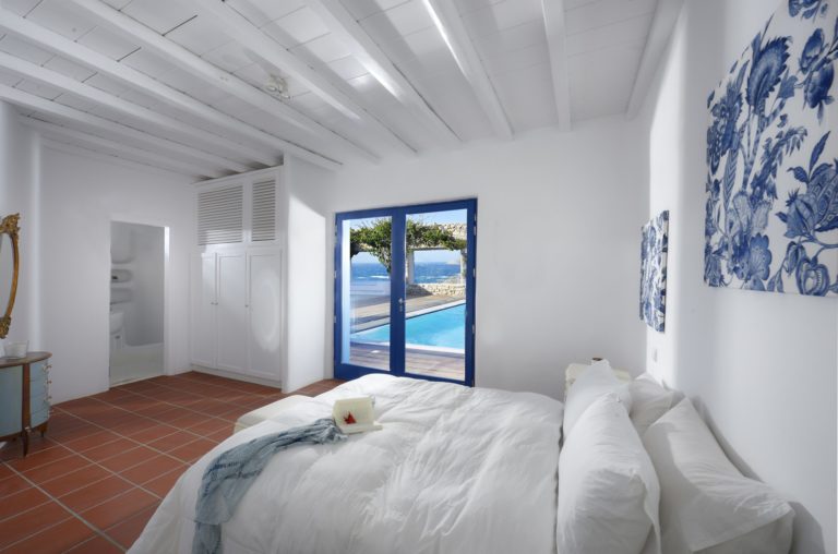 Bedroom with white ceiling beams villa for sale in Mykonos Greece