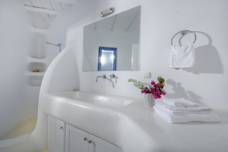 Typical, rounded soft edges to bathroom design villa for sale in Mykonos Greece