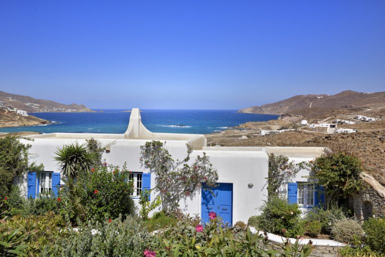 Typical blue and white Mediterranean style villa property for sale in Mykonos Greece