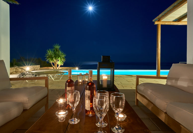A glass of wine with spectacular views, villa for sale in Crete Greece