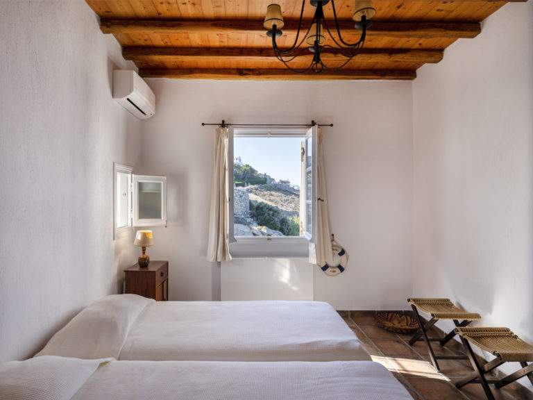 Bedrooms have wood beams in the ceiling property for sale in Mykonos Greece
