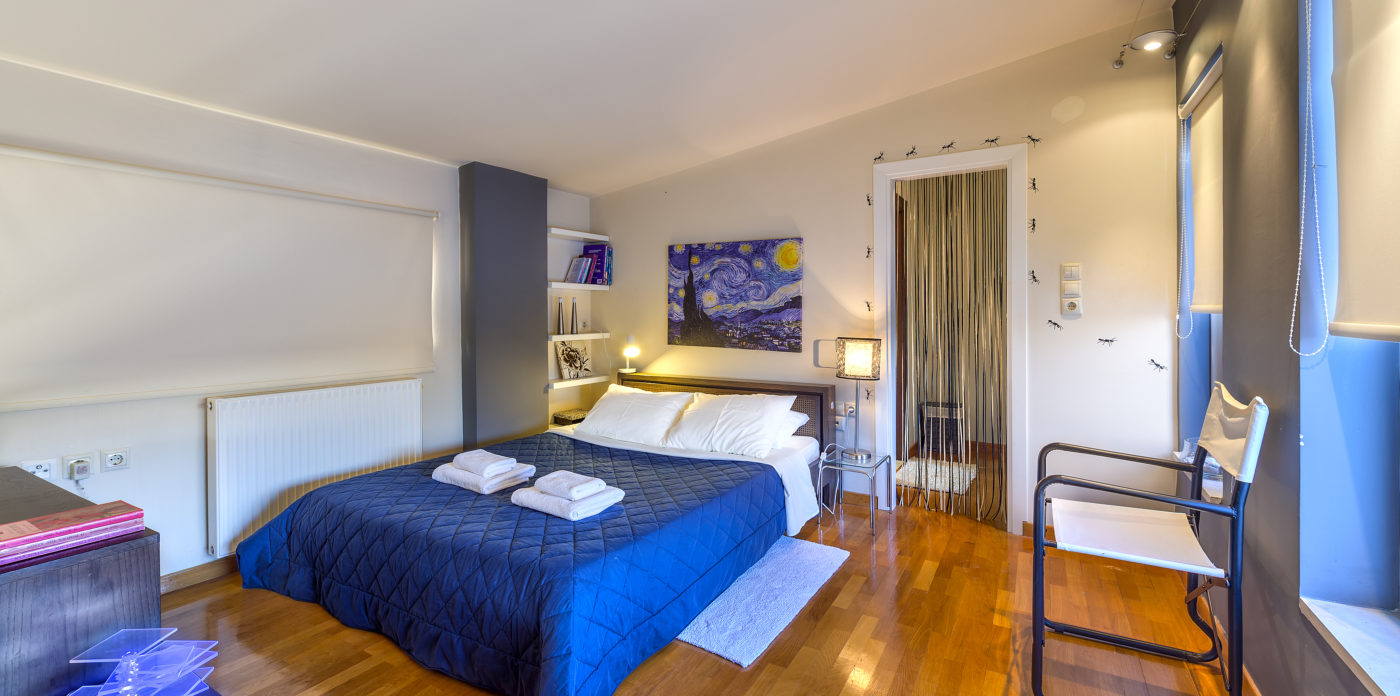 Bedrooms have warm wood floors villa for sale in Crete Greece