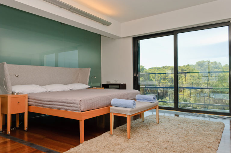 Bedroom overlooking lush greenery, property for sale in Porto Heli, Greece