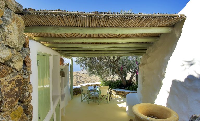 Pale green wood and bamboo fit the surroundings, property for sale in Mykonos, Greece