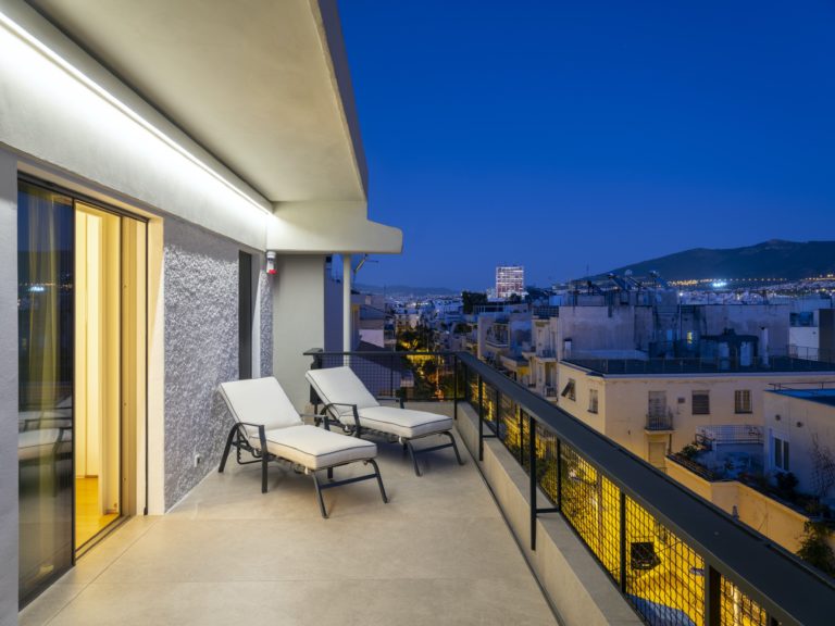 Relax on a sun lounger enjoying the buzz below property for sale in Athens Greece