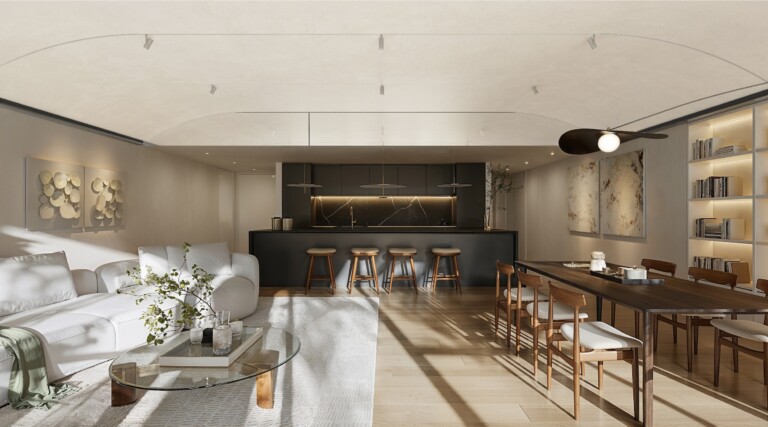 Kitchen of a FIX Residences apartment with dark cabinetry, island and bar seating