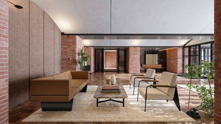 Private residents' lounge at FIX Residences with exposed brick walls and leather seating