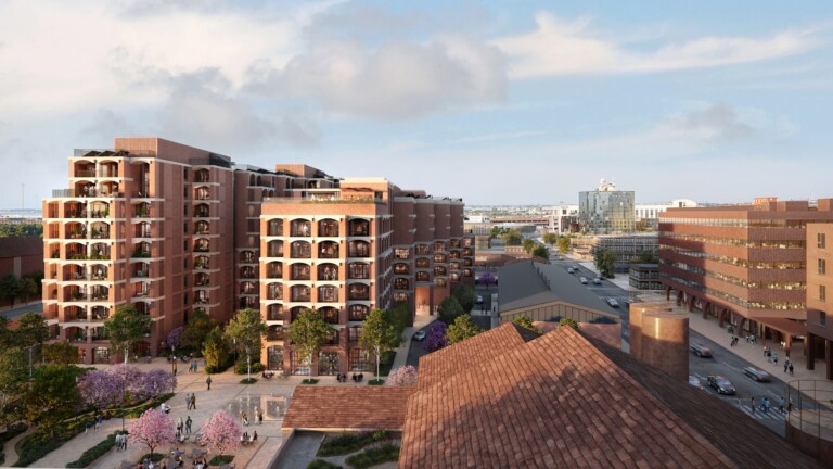 Elevated view over FIX Residences towards the Thessaloniki skyline, with the tiled roofs of the historic brewery in the foreground