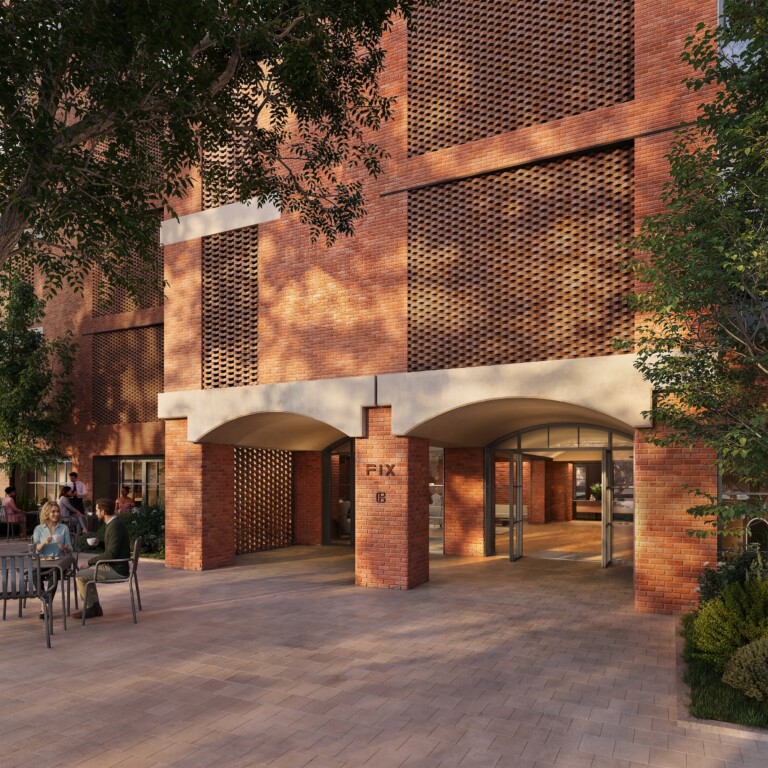 Residents' entrance of FIX Residences, Thessaloniki, with perforated brickwork and twin arches